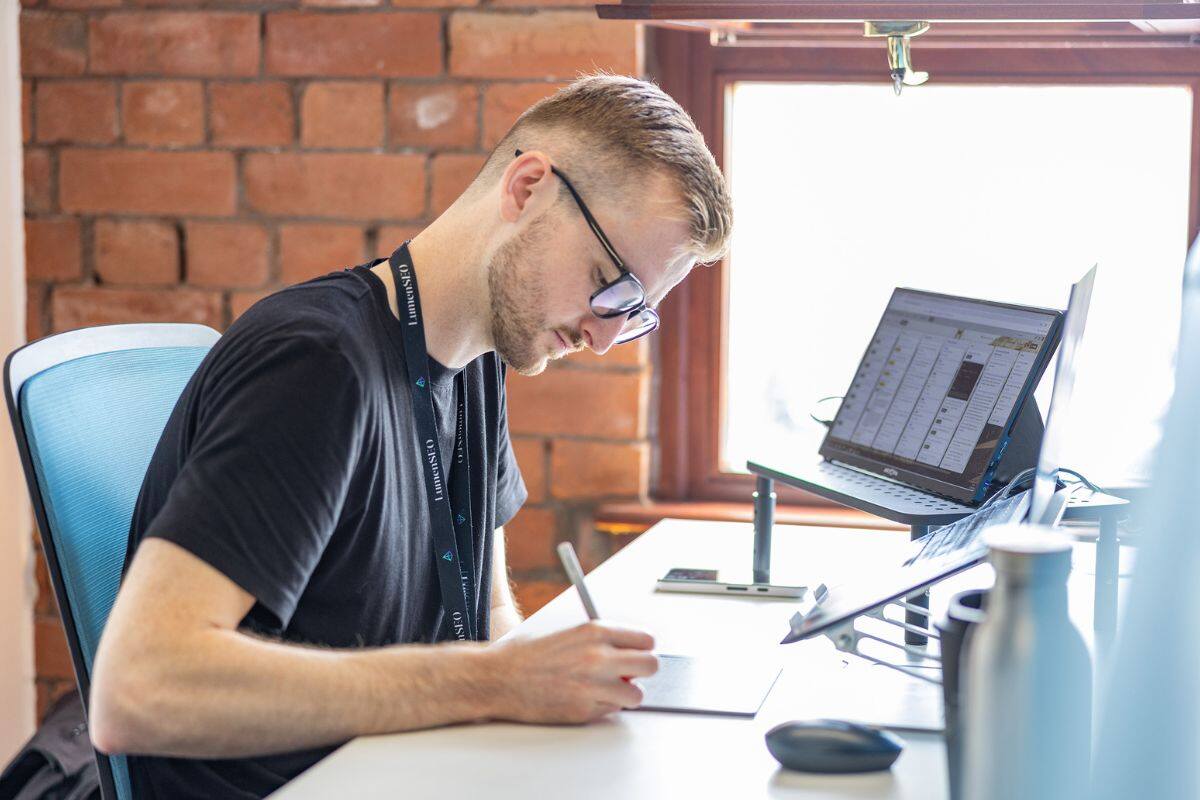 Aled working at his desk.