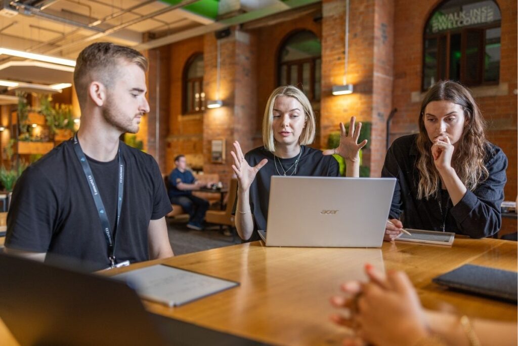 Lumen SEO team discussing a topic in a meeting.